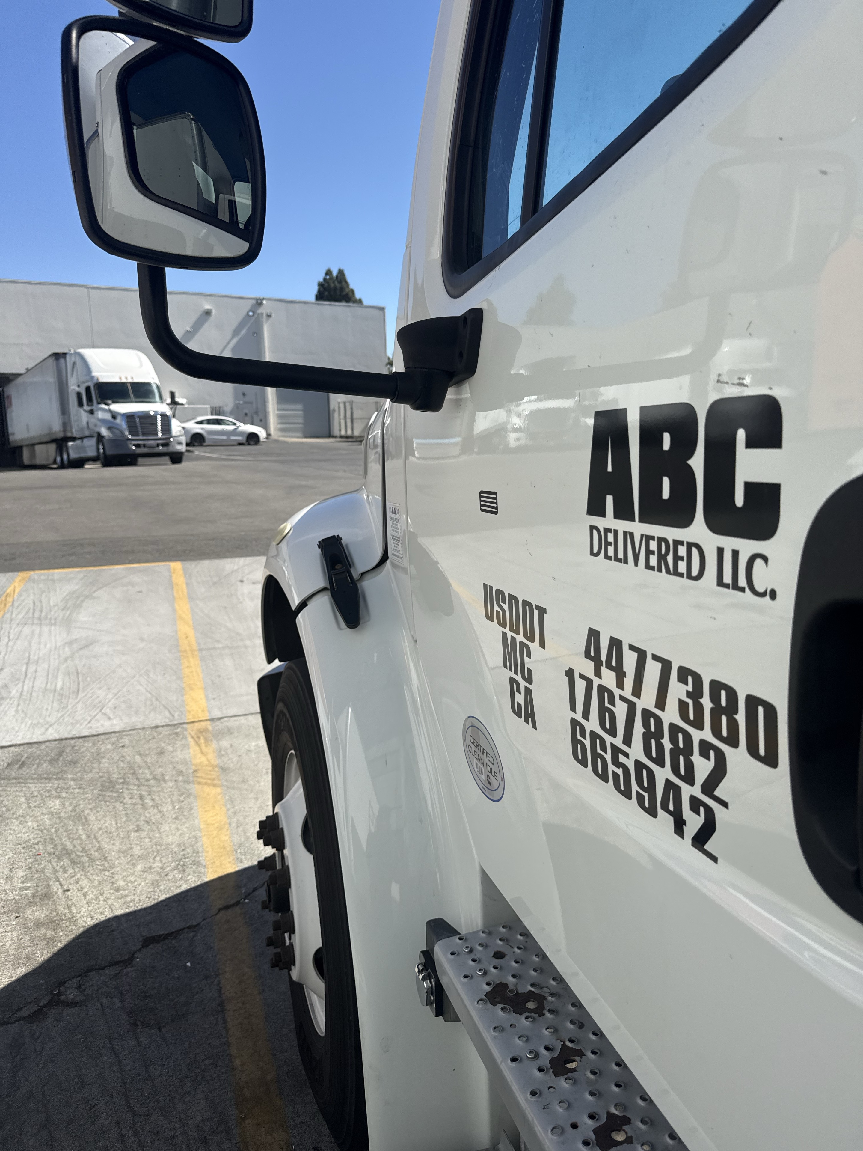 ABC DELIVERED LLC name and federal operating identifiers displayed on the truck door