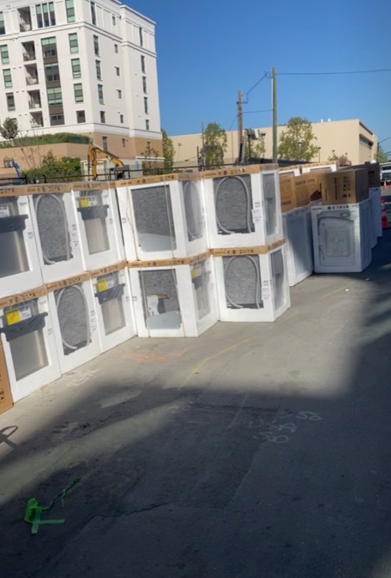 Appliances staged outside unoccupied units during prior multifamily project work